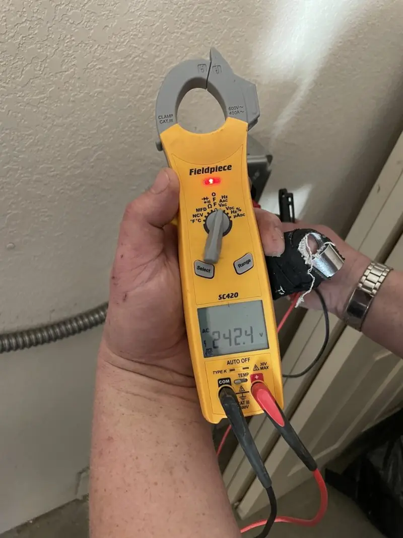 Voltage testing with clamp meter during Ceiling Fan Installation in Harrisburg